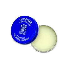 Load image into Gallery viewer, Open People of Substance tattoo balm jar with the blue lid beside the balm